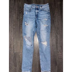 Distressed light blue straight leg jeans
